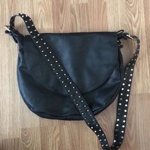 Black vegan leather bag with studded guitar strap